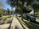 Charming street view with tree-lined sidewalks and beautifully landscaped yards at 21166 W Main St, Buckeye, AZ 85396
