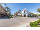 Street view of building, showcasing its architecture, palm trees, and landscaping on a sunny day at 21166 W Main St, Buckeye, AZ 85396