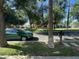 Scenic street view showcases lush trees and the home across the street, conveying a tranquil atmosphere at 21166 W Main St, Buckeye, AZ 85396