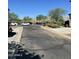 Street view of homes, landscaping, and cars at 21166 W Main St, Buckeye, AZ 85396