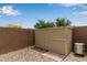 Backyard featuring a corrugated metal shed and a surrounding rockscape for low-maintenance landscaping at 24327 N 163Rd Dr, Surprise, AZ 85387