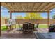 Inviting backyard area featuring a pergola-covered patio with an outdoor dining area, perfect for gatherings at 24327 N 163Rd Dr, Surprise, AZ 85387