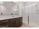 Contemporary bathroom featuring a walk-in shower, modern vanity, and neutral color scheme at 24327 N 163Rd Dr, Surprise, AZ 85387