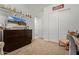 Cozy bedroom with a large television and built in closet for convenient storage at 24327 N 163Rd Dr, Surprise, AZ 85387