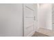 Clean, well-lit hallway with modern doors and neutral tones at 24327 N 163Rd Dr, Surprise, AZ 85387