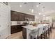 Stylish kitchen showcases a large island, stainless steel appliances, and open dining area at 24327 N 163Rd Dr, Surprise, AZ 85387