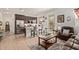 Open concept kitchen featuring stainless steel appliances, a breakfast bar, and easy access to the outdoor patio at 24327 N 163Rd Dr, Surprise, AZ 85387