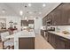 Well-lit kitchen featuring a central island with seating and stainless steel appliances at 24327 N 163Rd Dr, Surprise, AZ 85387