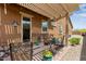 Cozy outdoor patio with a pergola, stone flooring, and comfortable seating, ideal for relaxation at 24327 N 163Rd Dr, Surprise, AZ 85387