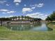 Scenic pond with fountains and lush landscaping, enhancing the community's natural beauty and tranquility at 24327 N 163Rd Dr, Surprise, AZ 85387