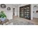 Elegant hallway with decorative cabinet display and view of the home's front entrance at 2546 E Russell St, Mesa, AZ 85213