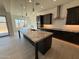 Beautiful kitchen with a large granite island and dark cabinets with stainless steel appliances at 2546 E Russell St, Mesa, AZ 85213
