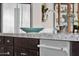 Close-up of the kitchen sink, faucet and countertops, with stainless steel appliances and cabinets at 2546 E Russell St, Mesa, AZ 85213