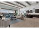 Spacious open floor plan featuring wood beams, comfortable seating and seamless indoor-outdoor living at 2546 E Russell St, Mesa, AZ 85213