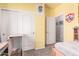 Bedroom with yellow walls, sliding closet doors and carpet floors at 2635 E Riviera Dr, Chandler, AZ 85249