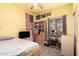 Bedroom with yellow walls featuring a ceiling fan, carpet floors, and natural light at 2635 E Riviera Dr, Chandler, AZ 85249