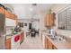 Kitchen with modern appliances, ample counter space, and open layout leading into the dining area with natural light at 2635 E Riviera Dr, Chandler, AZ 85249