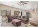Living room with comfortable furniture, large windows, and view into the dining area with a Coca-Cola light fixture at 2635 E Riviera Dr, Chandler, AZ 85249
