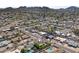 Scenic aerial shot of a community highlights tranquil streets with a backdrop of rolling mountains at 2902 E Corrine Dr, Phoenix, AZ 85032