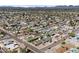 Expansive aerial view of a residential neighborhood with mountain views and tree-lined streets at 2902 E Corrine Dr, Phoenix, AZ 85032