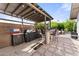 Outdoor patio area with a grill, perfect for outdoor cooking and entertaining at 2902 E Corrine Dr, Phoenix, AZ 85032
