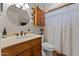 Cozy bathroom with granite countertops, new fixtures, and a shower with a shower curtain at 2902 E Corrine Dr, Phoenix, AZ 85032