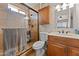 Updated bathroom featuring a glass-enclosed shower, modern vanity, and stylish fixtures at 2902 E Corrine Dr, Phoenix, AZ 85032