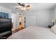 Spacious bedroom featuring hardwood floors, a ceiling fan, and an ensuite bathroom at 2902 E Corrine Dr, Phoenix, AZ 85032