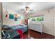 Comfortable bedroom with a large window for natural light at 2902 E Corrine Dr, Phoenix, AZ 85032