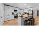 Modern kitchen with white cabinets, stainless steel appliances, and an island at 2902 E Corrine Dr, Phoenix, AZ 85032