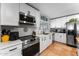 Well-equipped kitchen with stainless steel appliances and white cabinets at 2902 E Corrine Dr, Phoenix, AZ 85032