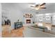 Warm and inviting living room with a white brick fireplace and comfortable furnishings at 2902 E Corrine Dr, Phoenix, AZ 85032