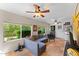 Cozy sun room with large windows, comfortable seating, and tile flooring at 2902 E Corrine Dr, Phoenix, AZ 85032