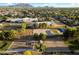 Aerial view of a school, neighborhood, desert landscaping, and mountain backdrop at 3003 E Ironside Ln, Gilbert, AZ 85298