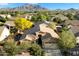 Expansive aerial shot showcasing the house with mountain views and a well-maintained neighborhood at 3003 E Ironside Ln, Gilbert, AZ 85298