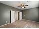 A carpeted room with a double-door closet offering easy access, enhancing the room's appeal at 3003 E Ironside Ln, Gilbert, AZ 85298