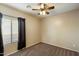 A cozy bedroom with soft carpeting, light-colored walls, and a ceiling fan providing natural light at 3003 E Ironside Ln, Gilbert, AZ 85298