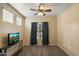 Cozy bedroom featuring neutral walls, carpet, a ceiling fan, and windows with a pleasant view at 3003 E Ironside Ln, Gilbert, AZ 85298