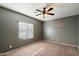 A cozy room with neutral walls, carpeting, and a window, ideal for a home office or extra space at 3003 E Ironside Ln, Gilbert, AZ 85298