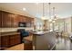 Kitchen with wooden cabinets and countertops, offering an open view to a dining area at 3003 E Ironside Ln, Gilbert, AZ 85298
