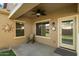 Covered patio with a ceiling fan, rocking chair, and a view of the backyard at 3003 E Ironside Ln, Gilbert, AZ 85298