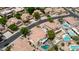 Magnificent house with a swimming pool and backyard, complemented by a spacious lawn and mature trees at 3166 E Desert Willow Rd, Phoenix, AZ 85048