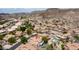 An aerial shot shows a community featuring beautiful homes with refreshing pools in a desert environment at 3166 E Desert Willow Rd, Phoenix, AZ 85048