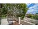 Second-story balcony overlooking the neighboring houses and shaded by mature tree at 3166 E Desert Willow Rd, Phoenix, AZ 85048