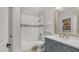 Well-lit bathroom with a shower-tub combo, vanity, and modern fixtures, creating a functional space at 3166 E Desert Willow Rd, Phoenix, AZ 85048