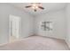 Bedroom featuring plush carpet, a ceiling fan, and a closet for ample storage space at 3166 E Desert Willow Rd, Phoenix, AZ 85048