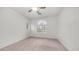 Inviting bedroom featuring carpet, a ceiling fan, and decorative windows for natural light and comfort at 3166 E Desert Willow Rd, Phoenix, AZ 85048