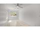Bright, empty bedroom with lots of natural light and tile flooring at 3166 E Desert Willow Rd, Phoenix, AZ 85048