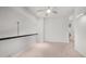 Bright bonus room with neutral carpet, light ceiling fan, and well-lit sconce lighting at 3166 E Desert Willow Rd, Phoenix, AZ 85048