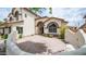 Stunning two-story home boasts an inviting front courtyard with beautiful desert landscaping at 3166 E Desert Willow Rd, Phoenix, AZ 85048